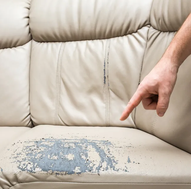 A damaged couch demonstrating why protection is needed during moves